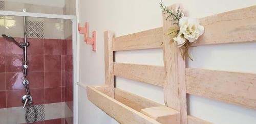 a wooden ladder in a bathroom with a shower at B&B CARRUBBELLE in Ragusa
