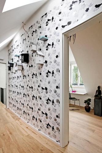 a room with a wall covered in black and white butterflies at Villa Delange in Landau in der Pfalz
