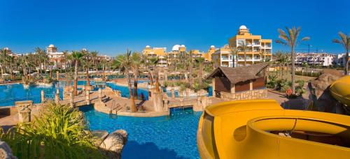 a resort with a water park with a water slide at Playazimbali in Vera