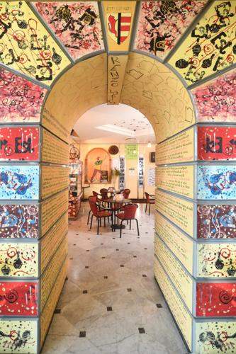 an archway in a room with a table and chairs at Hotel Italia & Lombardi in Montefiascone