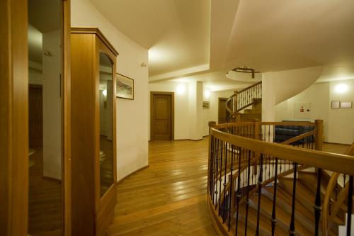 a hallway with a staircase in a house at Penzión Paula in Tatranská Lomnica