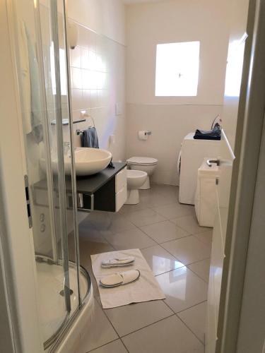 a bathroom with a sink and a toilet and a shower at ABCdecor Italia in Imperia