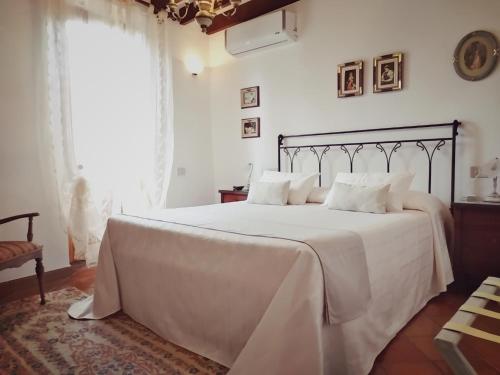 Cama o camas de una habitación en Mulino Di Quercegrossa