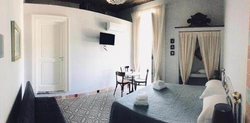 Кровать или кровати в номере Borgo Civico 10