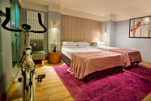 a hotel room with a large bed and a camera at Parkhouse Hotel & Spa in Istanbul