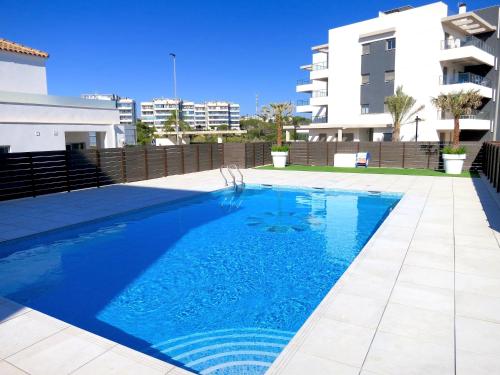 a swimming pool in front of a building at El Mirador De Villamartin - La Zenia & Golf in Playas de Orihuela