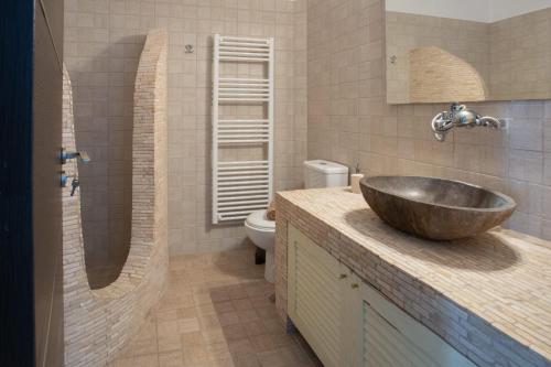 a bathroom with a sink and a toilet at Paros Central house in Parikia