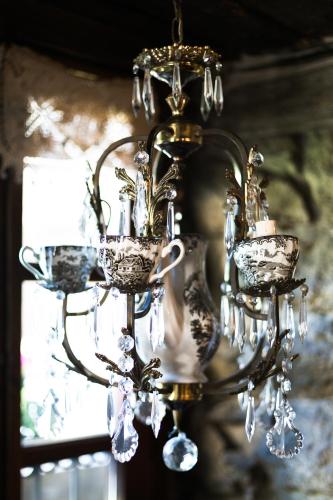 a chandelier is hanging from a wall at Hostal Cisco de Sans in Andorra la Vella