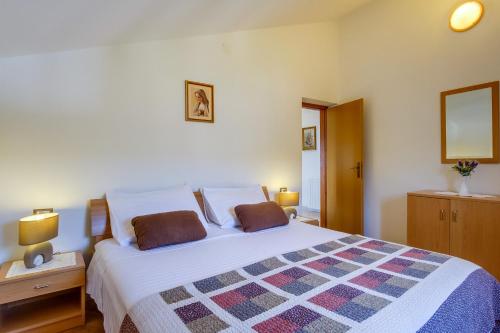 Posteľ alebo postele v izbe v ubytovaní Apartmani Zorica