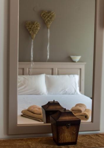 Postel nebo postele na pokoji v ubytování Maltezos Rooms