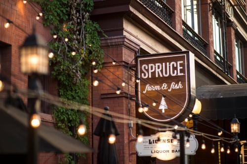 a sign for a store in front of a building at Hotel Boulderado in Boulder