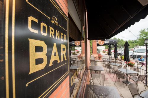 a sign on the side of a bar with tables and chairs at Hotel Boulderado in Boulder