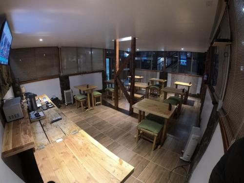 an overhead view of a restaurant with tables and chairs at Hotel Casa Algarrobo in San Pedro de Atacama