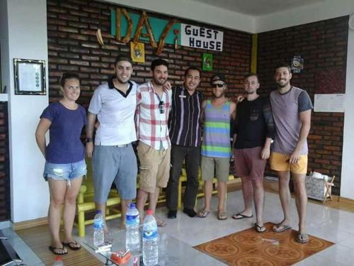 a group of people posing for a picture in a room at Dasi Guesthouse in Ende