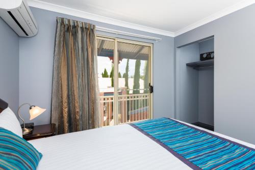 Postel nebo postele na pokoji v ubytování Quest Yelverton Kalgoorlie