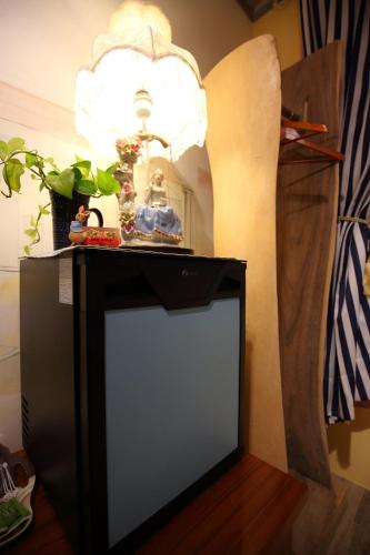 a black table with a light on top of it at Sweet Heart B&B in Jian