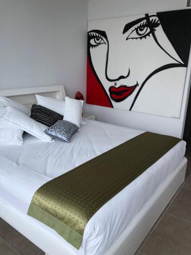 A bed or beds in a room at 8 ON ELYSEE Mooloolaba Beach