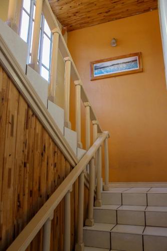 a staircase in a house with a stair case at Villas La Quinta in Creel