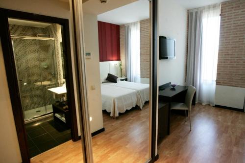 Postel nebo postele na pokoji v ubytování Hotel La Bastida