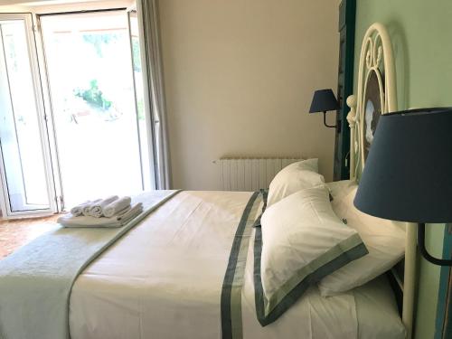 Postel nebo postele na pokoji v ubytování B&B La Casa di Alice