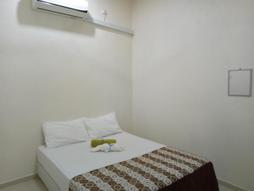 מיטה או מיטות בחדר ב-IDUL Sunrise View