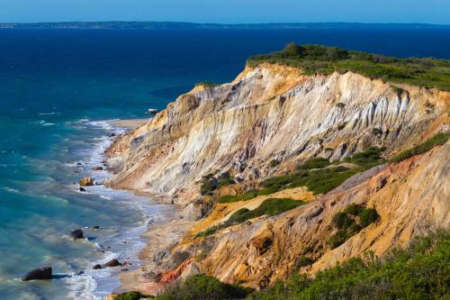 a view of a rocky cliff next to the ocean at #OB Pool House in Oak Bluffs