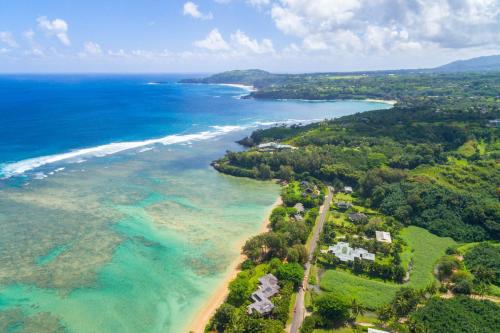 an aerial view of a beach and the ocean at Anini Ohana Hale TVNC#4255 in Kilauea