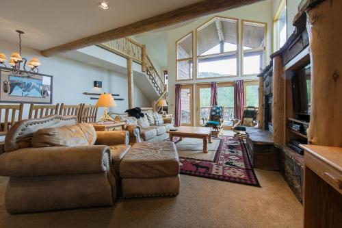a large living room with couches and a tv at Ski Slopes and Scenic Views in Whitefish