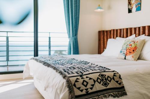 Chuanfanrock Haku Beach Days Innにあるベッド