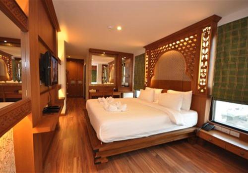 En eller flere senge i et værelse på Chalelarn Hotel Hua Hin