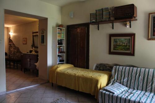 Ένα ή περισσότερα κρεβάτια σε δωμάτιο στο La Cascianella