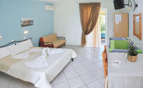 A bed or beds in a room at Panagiotis Hotel