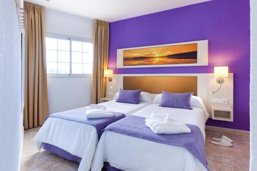 Postel nebo postele na pokoji v ubytování Checkin Bungalows Atlántida