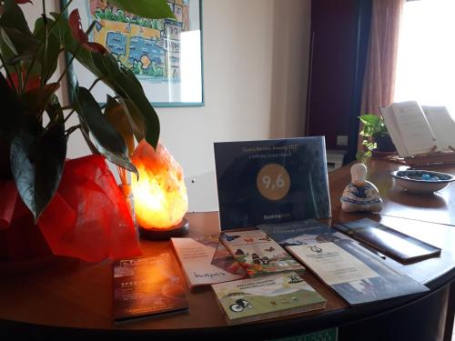 a desk with a laptop on top of a table at L'Infinito Agriturismo - Rooms & Breakfast in SantʼAlfio