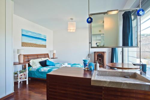 En eller flere senge i et værelse på Villa Casalinho Meco