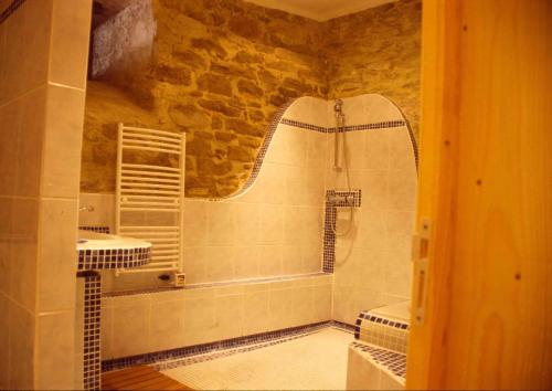 a bathroom with two sinks and a shower at Gite la Tour in Pépieux