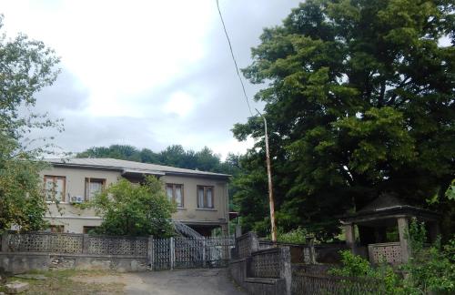 a house with a fence in front of it at Savanna House Jvari in Jvari