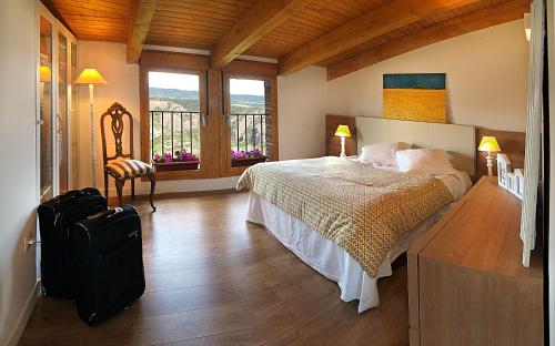Hotel Santa Maria de Alquezar tesisinde bir odada yatak veya yataklar