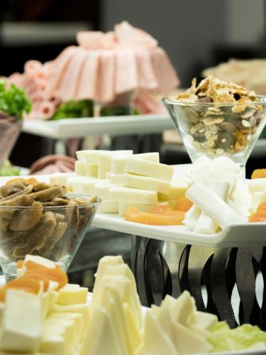 a bunch of different types of food on plates at Ilgaz Mountain Resort Hotel in Ilgaz