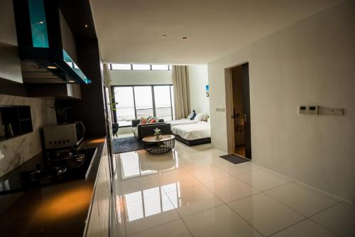 a living room with a couch and a table at Sunrise Gurney in George Town
