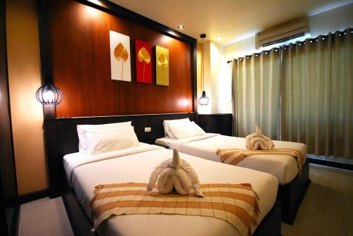 Katil atau katil-katil dalam bilik di Phufa Waree Chiangrai Resort - SHA Extra Plus