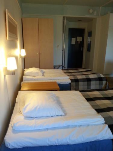 Postel nebo postele na pokoji v ubytování Hotel Kalkstrand