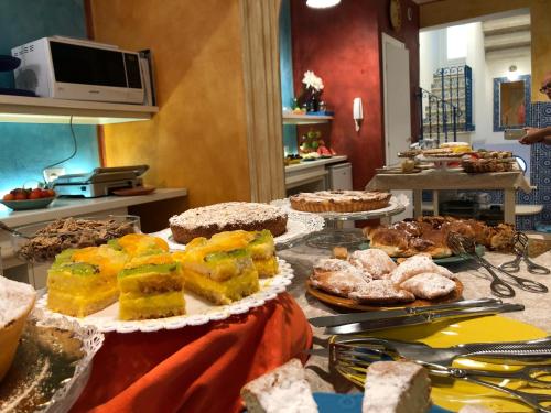 a buffet table filled with different types of food at Sant'Agostino Suites & Rooms in Mazara del Vallo