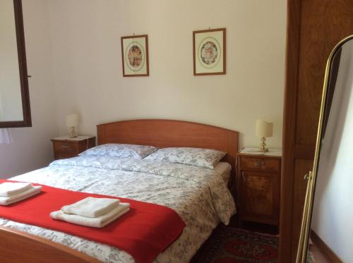 a bedroom with a bed with two towels on it at Casa Vacanze All'Orizzonte Duino in Duino