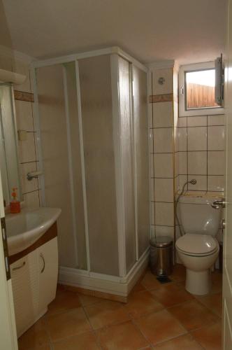 a bathroom with a toilet and a sink at Beach house in Nea Potidaea