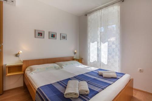 Postel nebo postele na pokoji v ubytování Sobe Ferlora