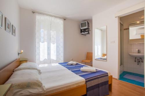 Postel nebo postele na pokoji v ubytování Sobe Ferlora