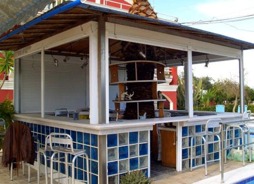 an outdoor bar with awning on a house at Crystal in Kavos