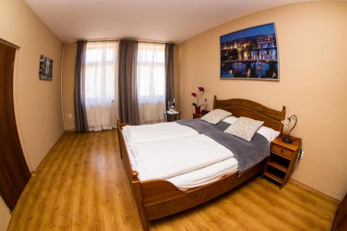 En eller flere senge i et værelse på Apartmán U krále Komenského