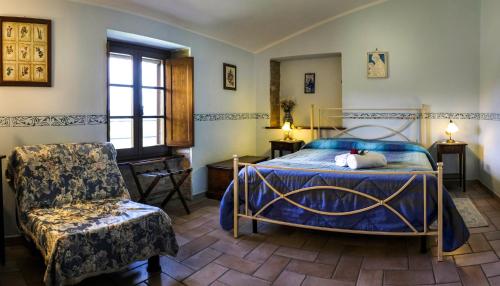 A bed or beds in a room at Agriturismo Casale Dei Frontini